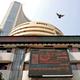 Sensex, Nifty settle almost flat in highly volatile trade; metal, power stocks drag