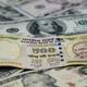 Rupee settles 2 paise higher at 87.30 against U.S. dollar